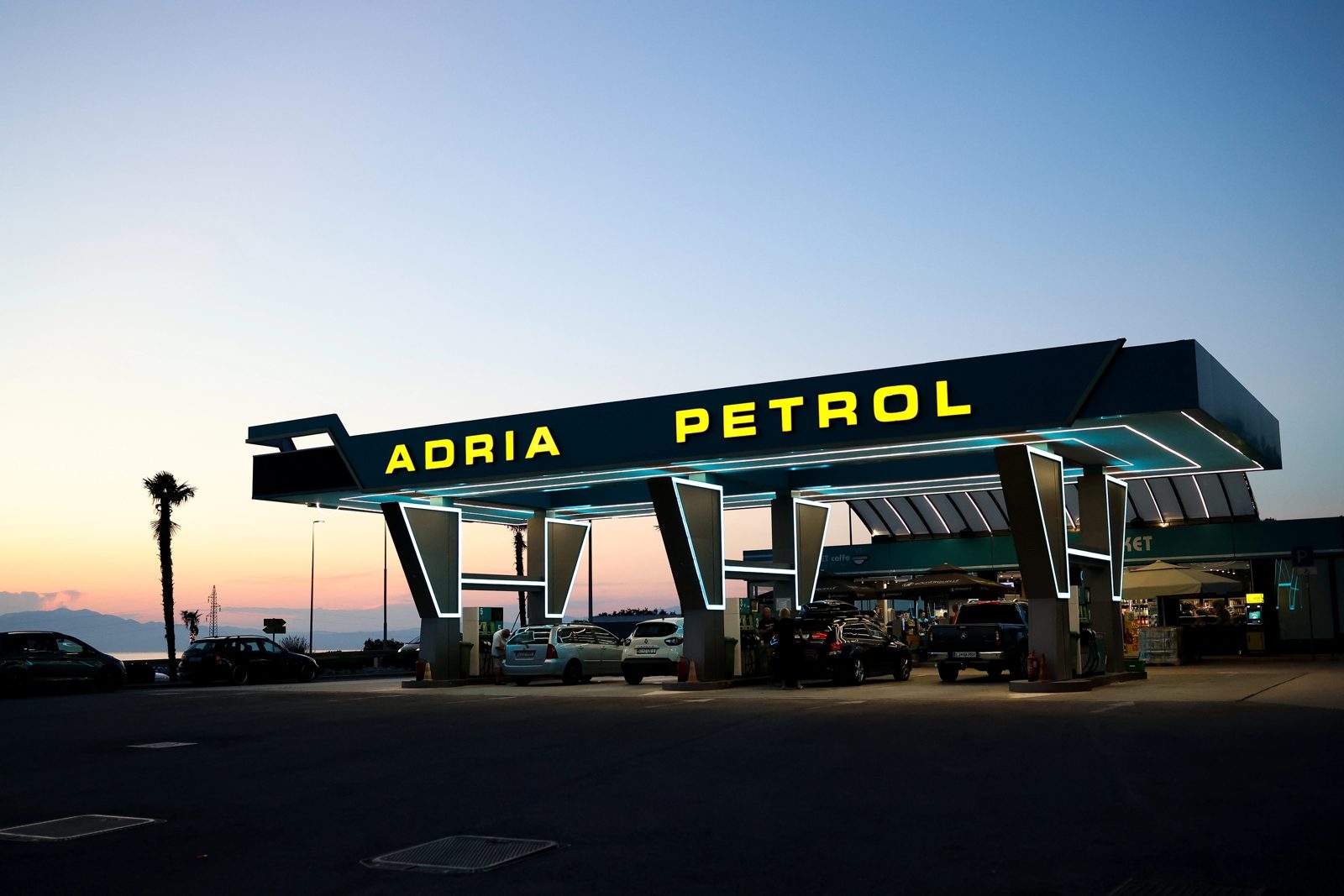 Adria Petrol Krk: the neon petrol station above Malinska, its Meet Caffe and the car meets