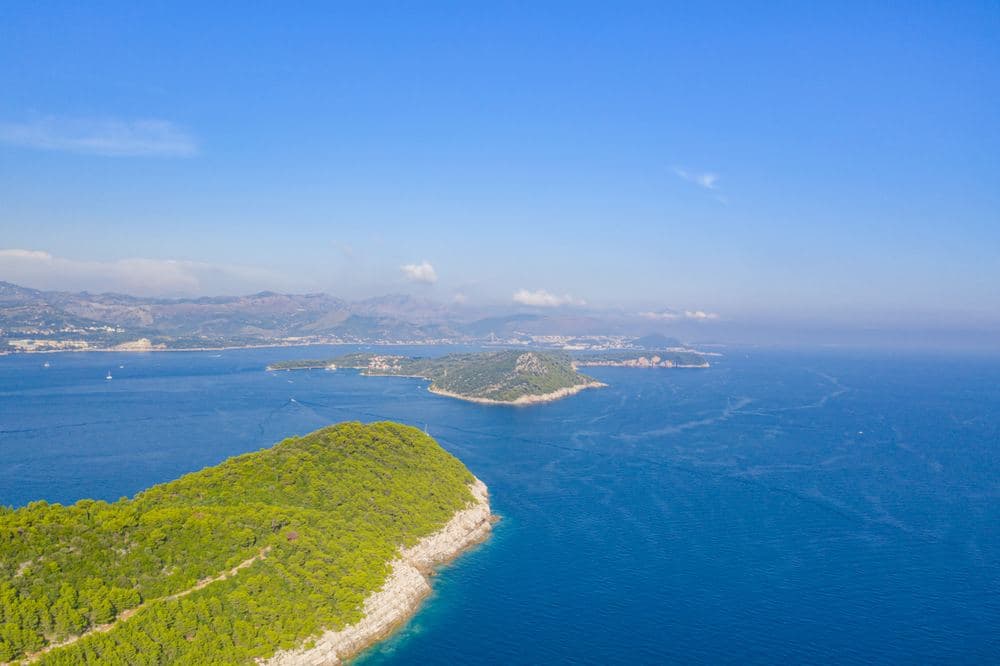 Koločep from the air, the cave is on the cliffs of the far side