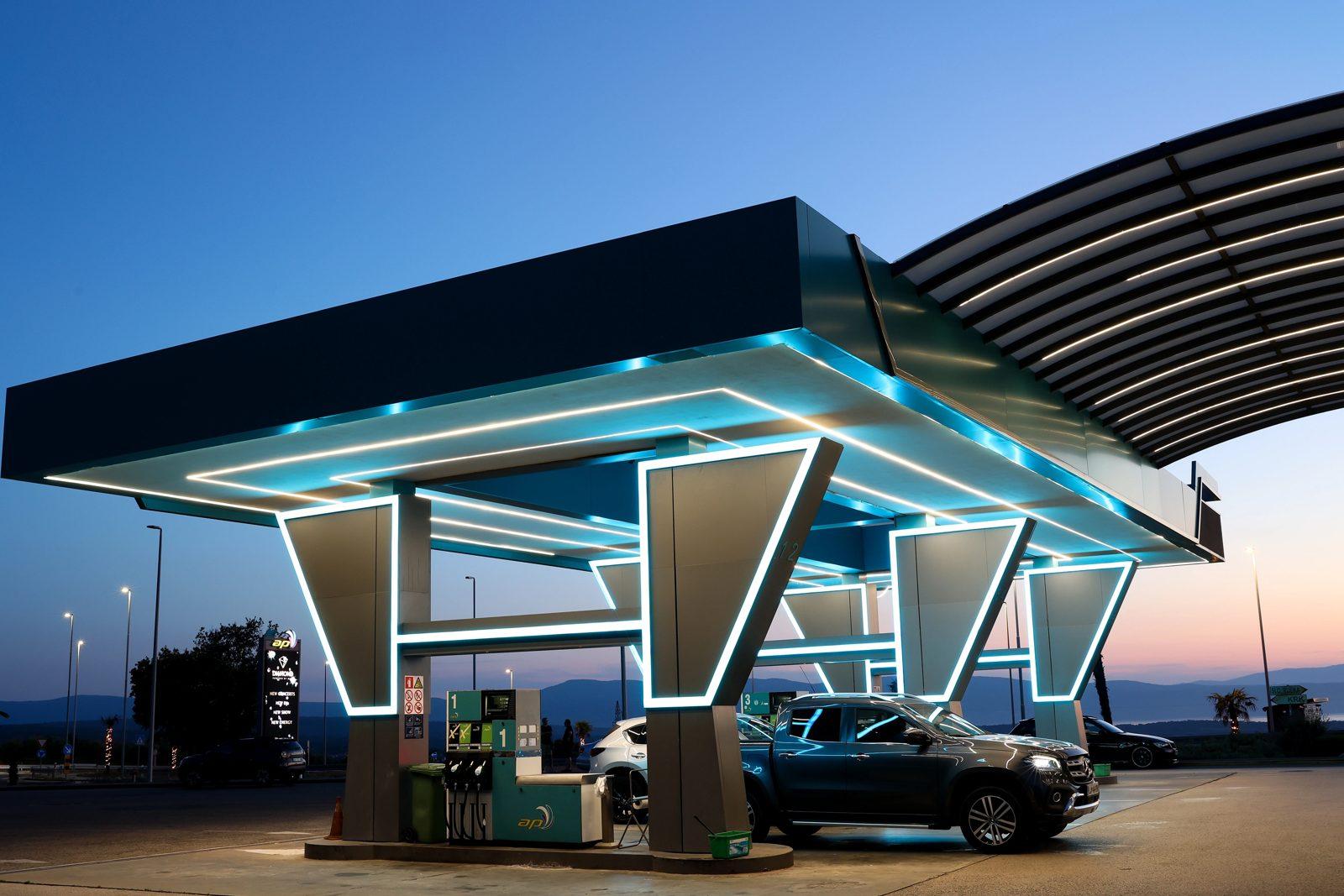 Close view of the neon-lined canopy of Adria Petrol against the evening sky