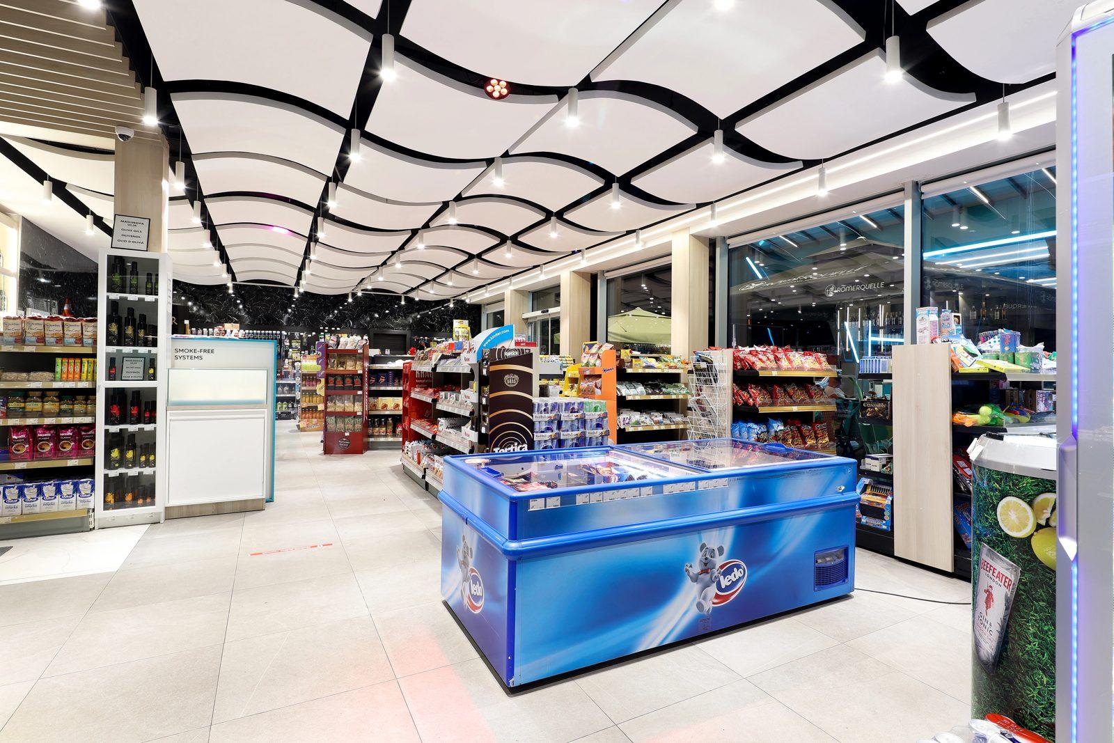 Inside the market of Adria Petrol with its curved ceiling and shelves