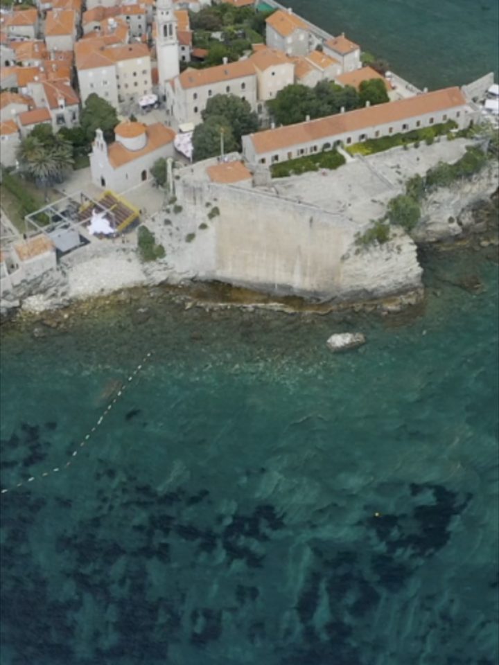 Old stone, red roofs and the Adriatic in one slow reveal