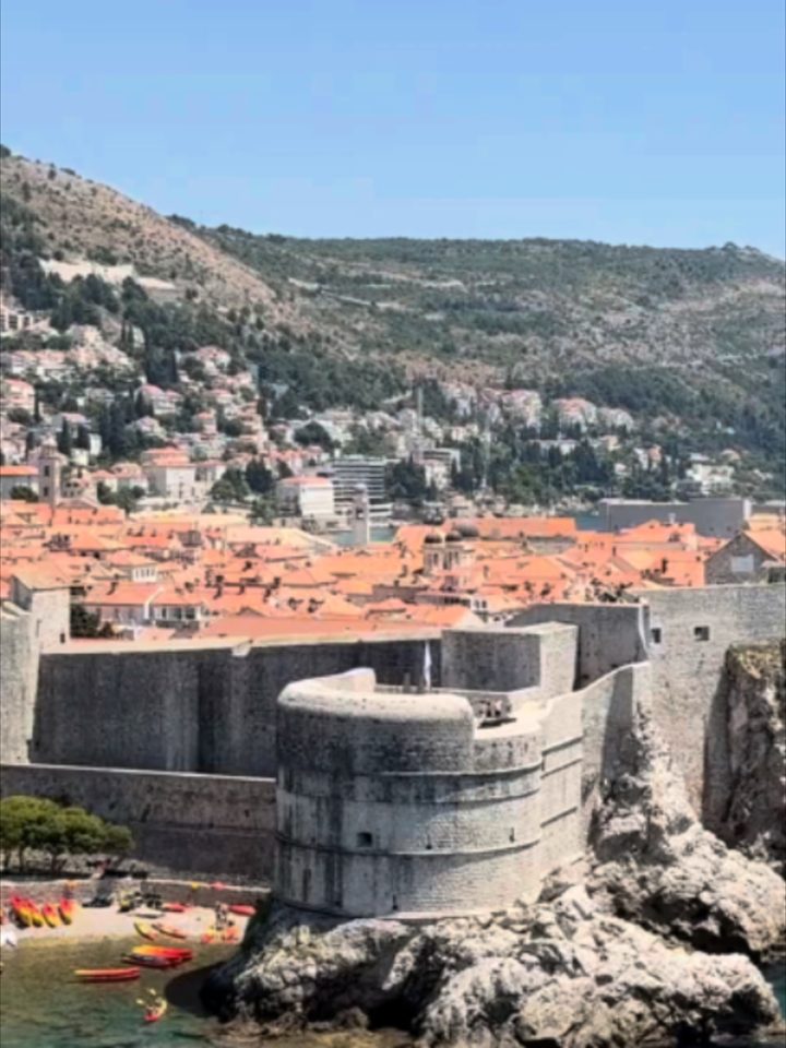 Kayaks below Dubrovnik's walls, the Adriatic sets the pace